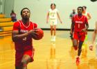 Bellville boy’s hoops holds off Sealy in OT thriller