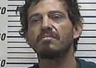 Glidden man arrested with drugs, guns and cash